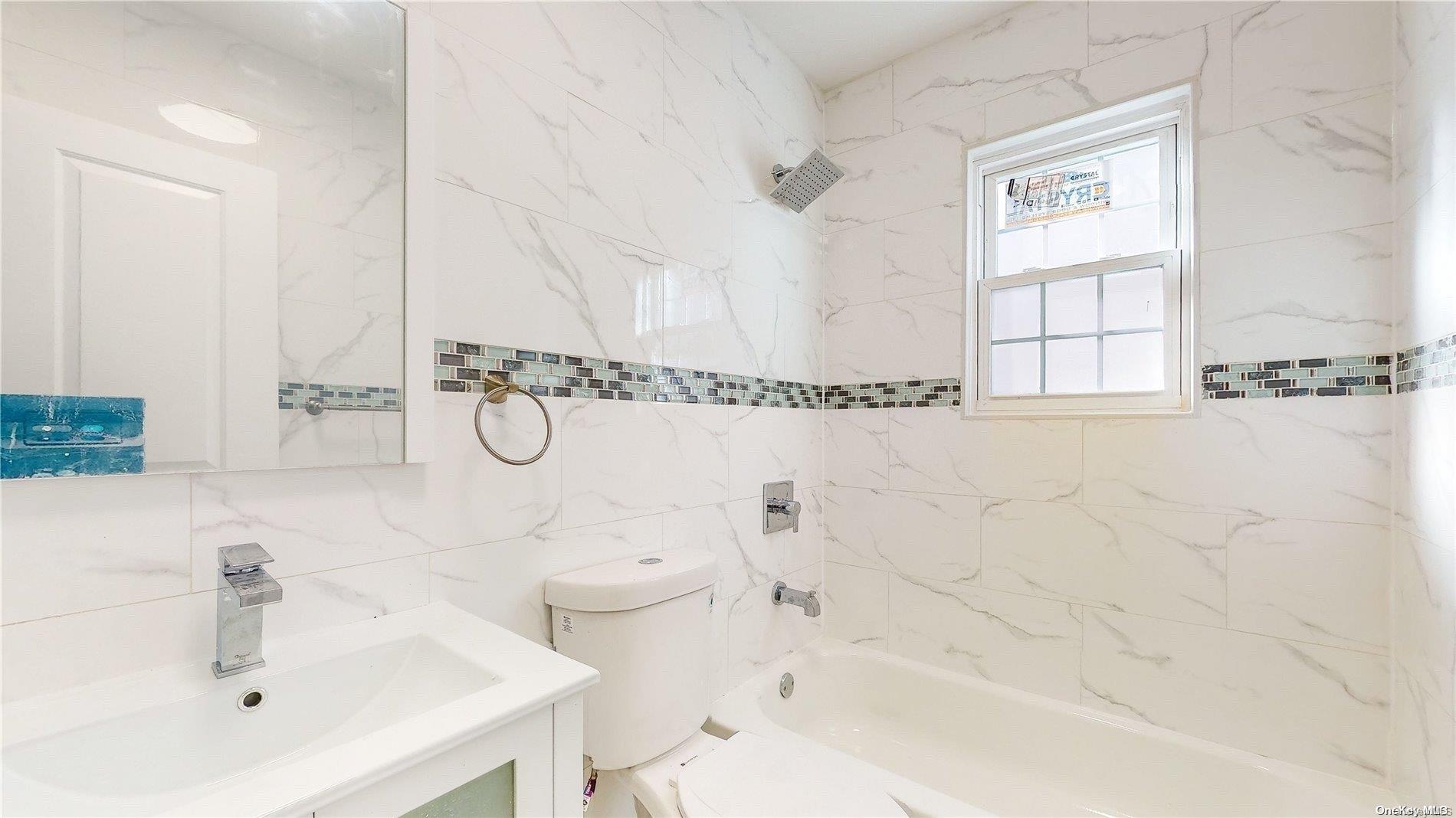 141-03 116th Avenue Queens, NY 11436 - Photo 4 of 4 a bathroom with a sink and a bathtub