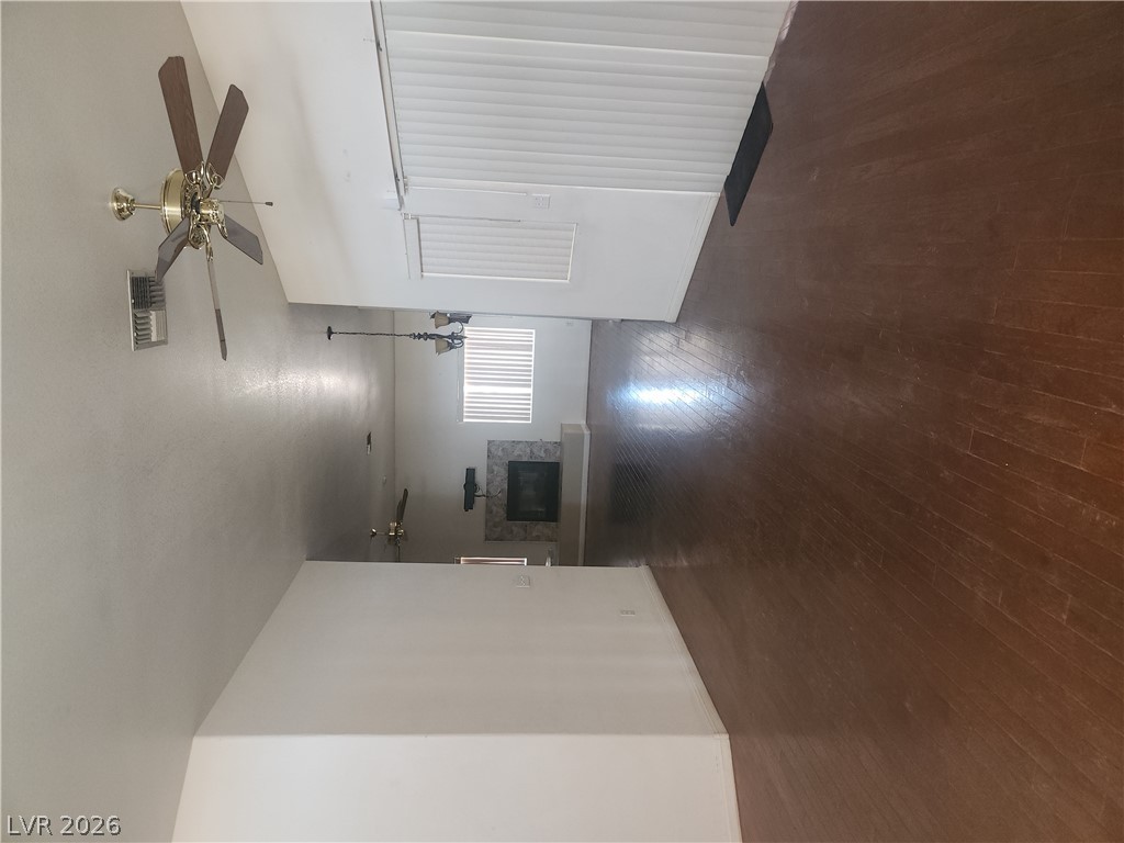564 Ridgeway Road Henderson, NV 89015 - Photo 2 of 22 Rich hardwood floors complement a neutral palette, creating an inviting living space with architectural details.