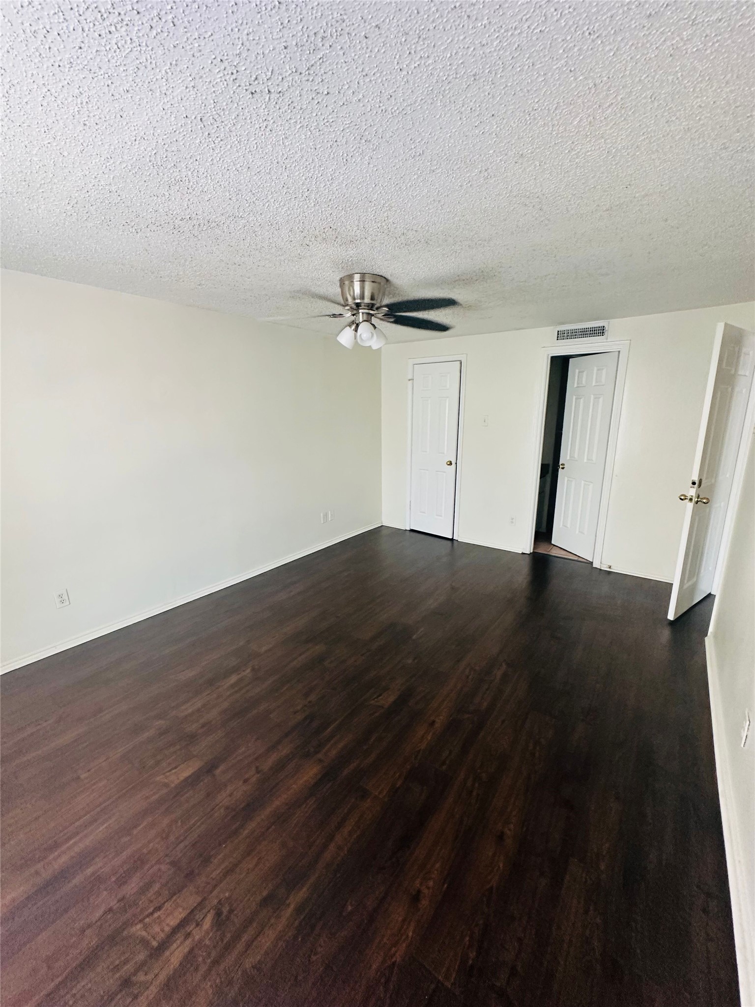 2401 Leon Street, Unit 307 Austin, TX 78705 - Photo 15 of 25 a view of a room with wooden floor