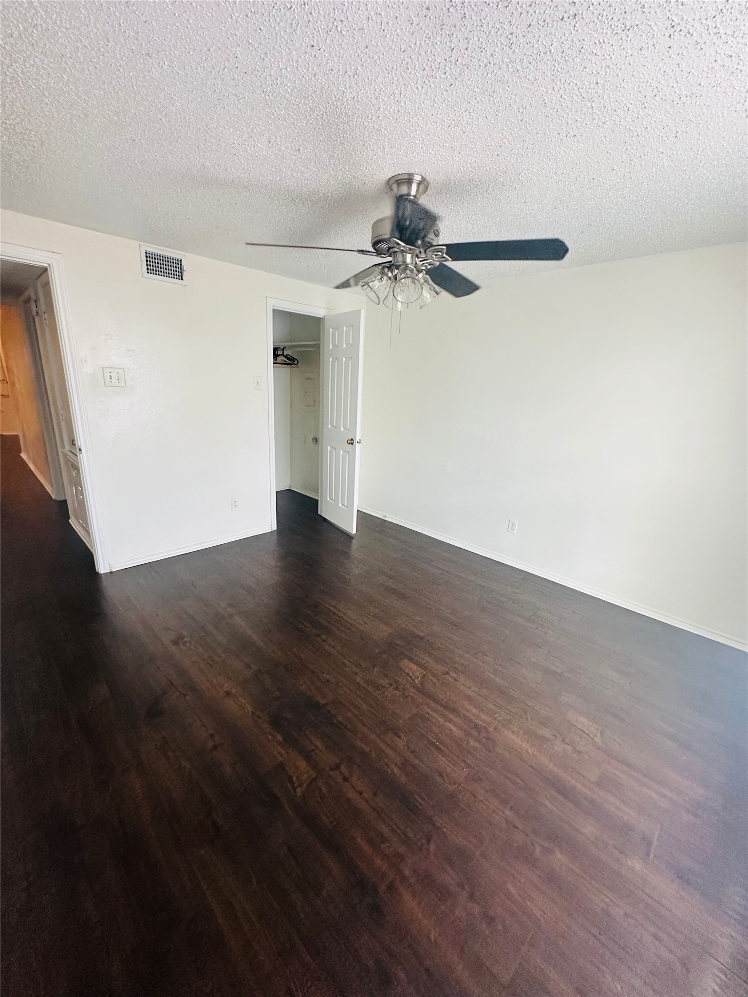 2401 Leon Street, Unit 307 Austin, TX 78705 - Photo 16 of 25 a view of a big room with wooden floor and windows