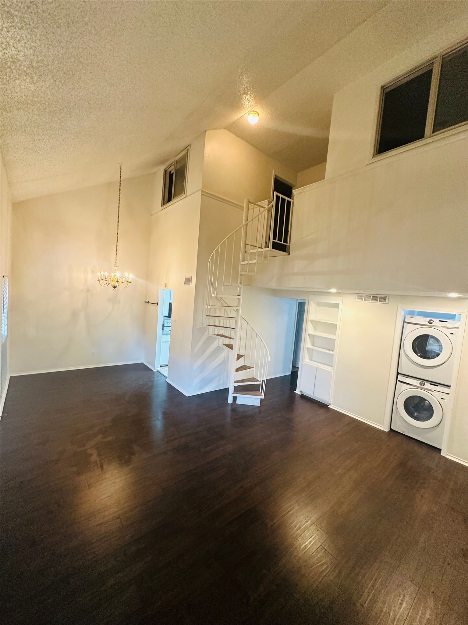 2401 Leon Street, Unit 307 Austin, TX 78705 - Photo 3 of 25 a view of a livingroom with wooden floor