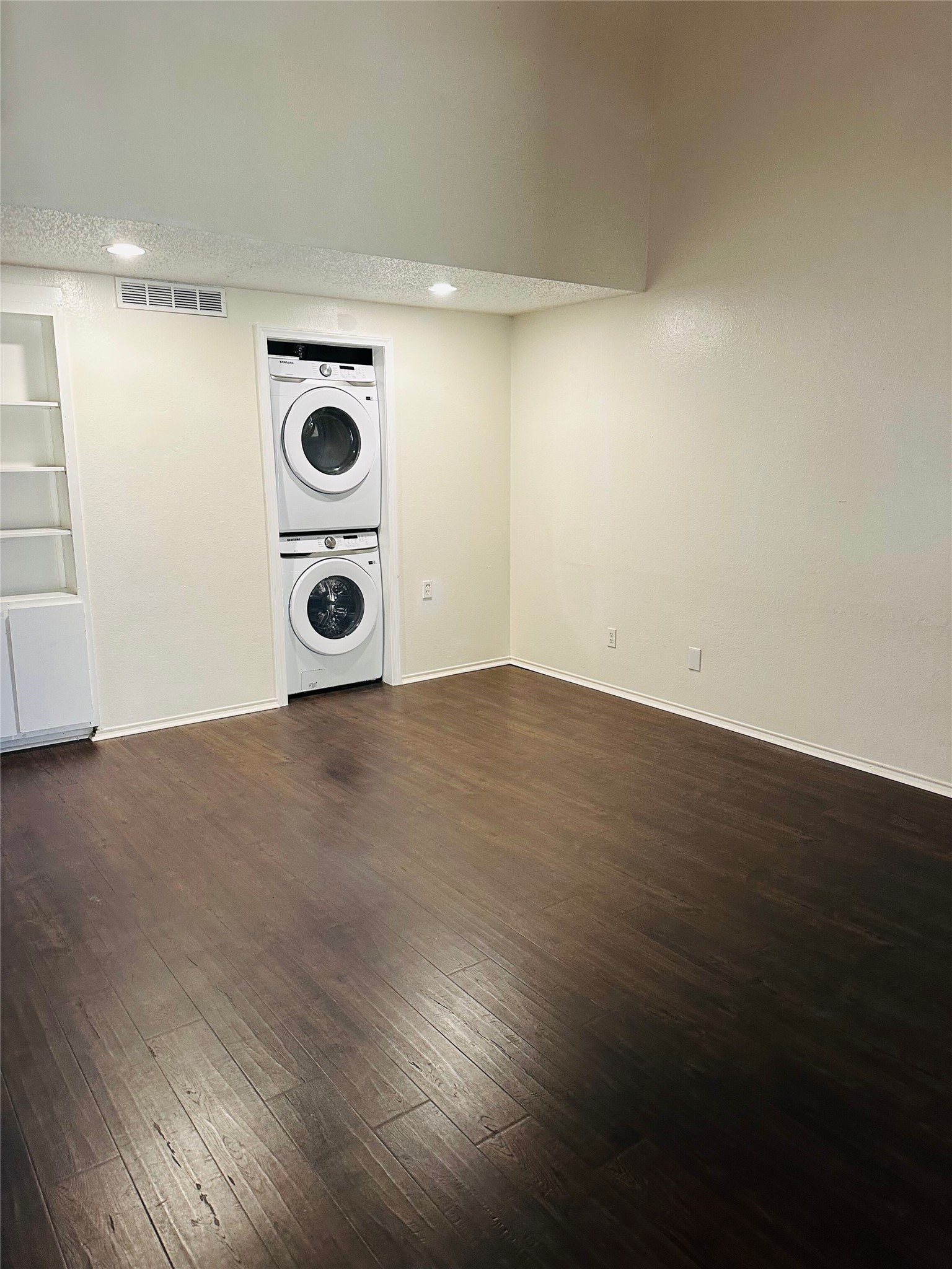2401 Leon Street, Unit 307 Austin, TX 78705 - Photo 4 of 25 a view of an empty room and wooden floor