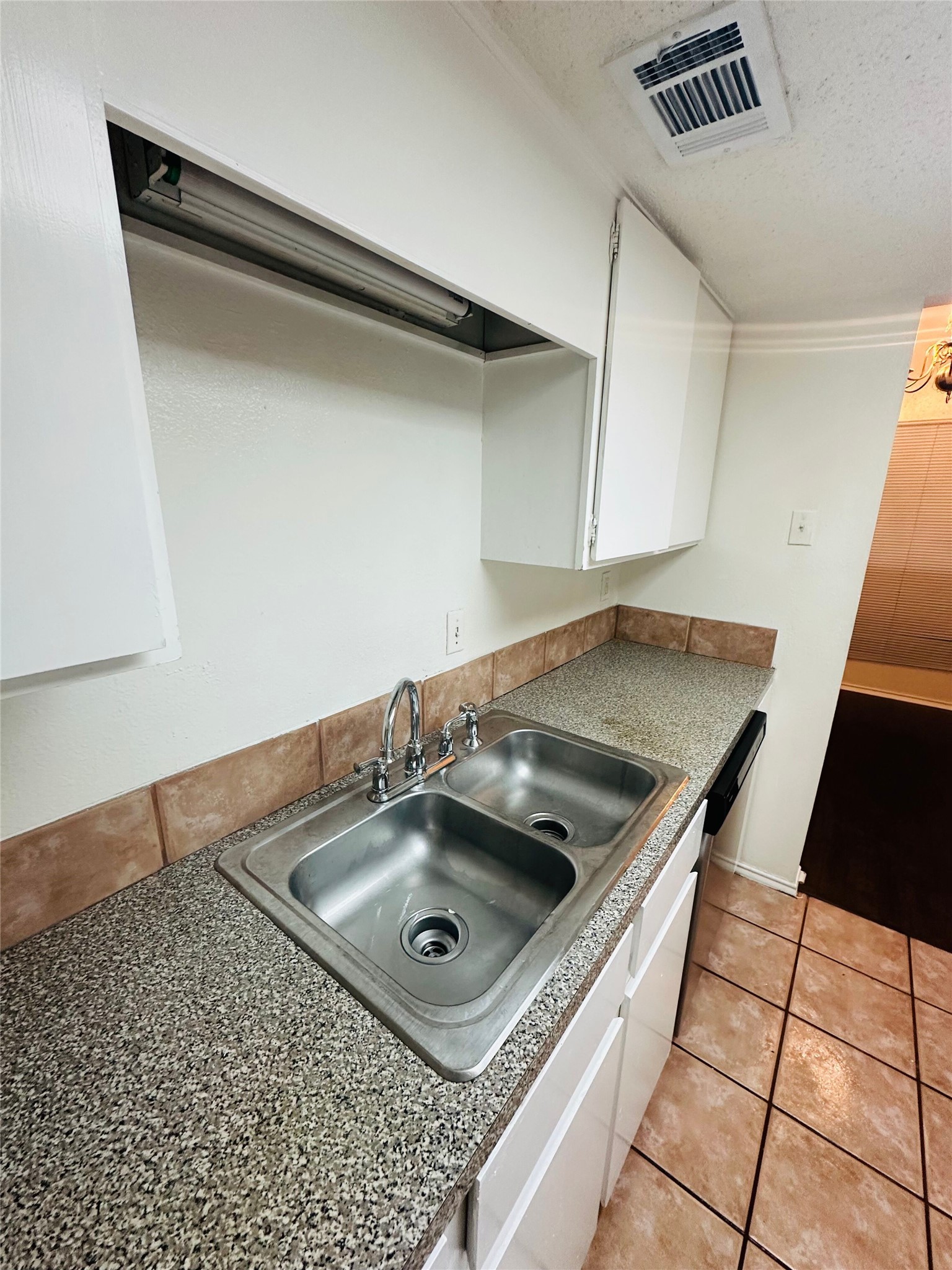 2401 Leon Street, Unit 307 Austin, TX 78705 - Photo 9 of 25 a kitchen with a sink a stove and a table