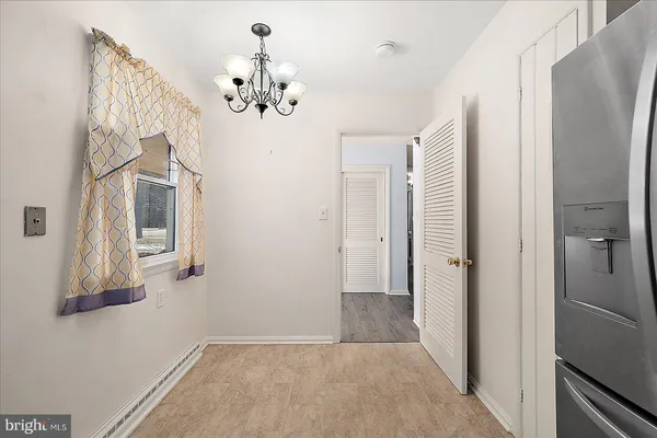 a kitchen with granite countertop cabinets stainless steel appliances and a window