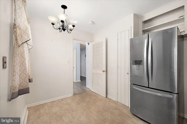 a kitchen with cabinets stainless steel appliances and a counter top space