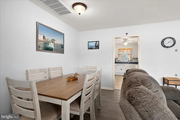 a bedroom with a bed and ceiling fan