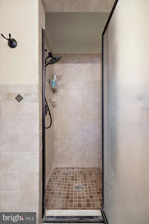a bathroom with a sink vanity and a mirror