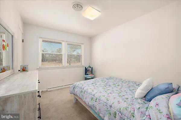a bedroom with a bed and a cabinets