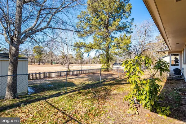 a view of hall way with furniture