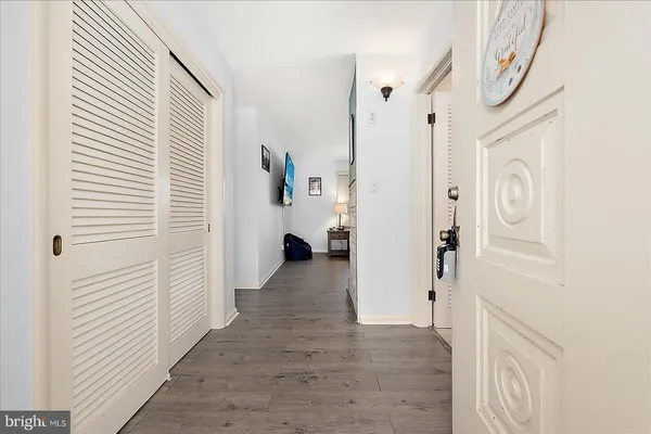 a living room with furniture a rug and a fireplace