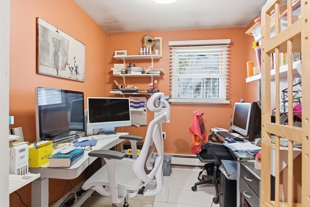 35 Errol Road Brockton, MA 02302 - Photo 13 of 20 a view of a workspace with furniture and a window
