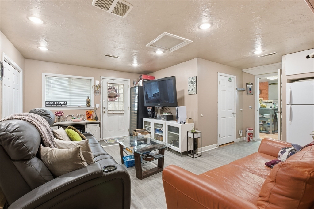 35 Errol Road Brockton, MA 02302 - Photo 15 of 20 a living room with furniture and a flat screen tv