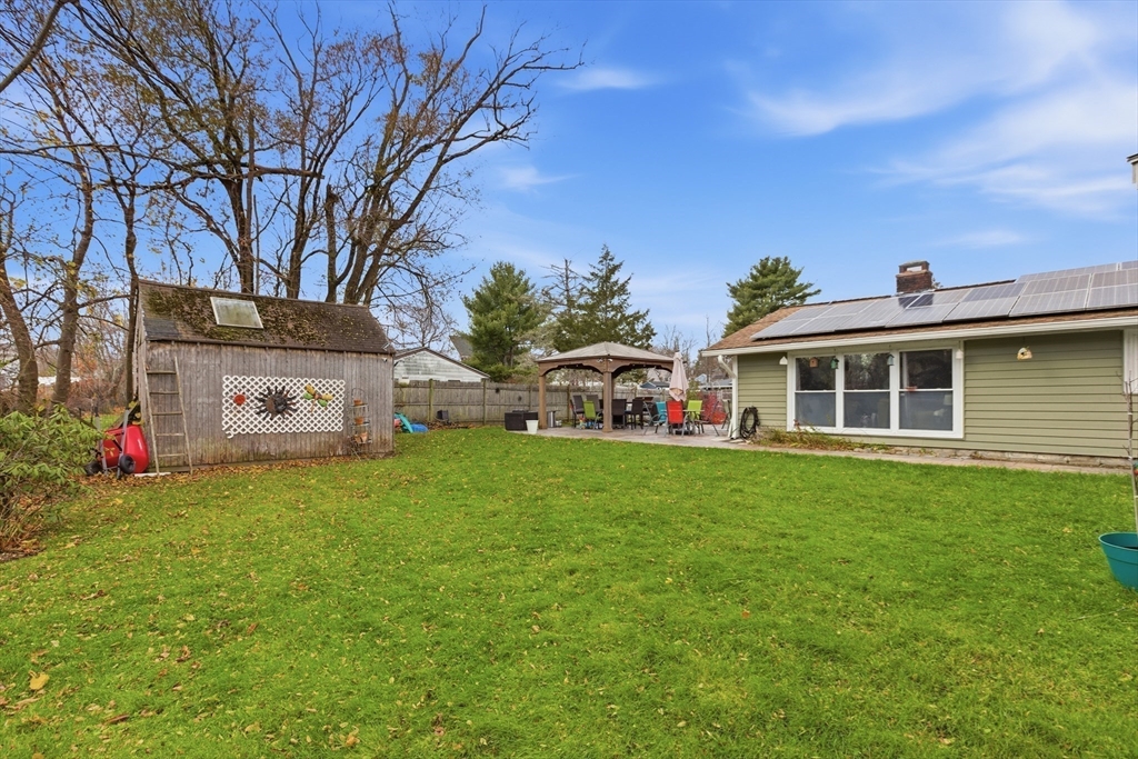 35 Errol Road Brockton, MA 02302 - Photo 17 of 20 a front view of a house with a garden and yard