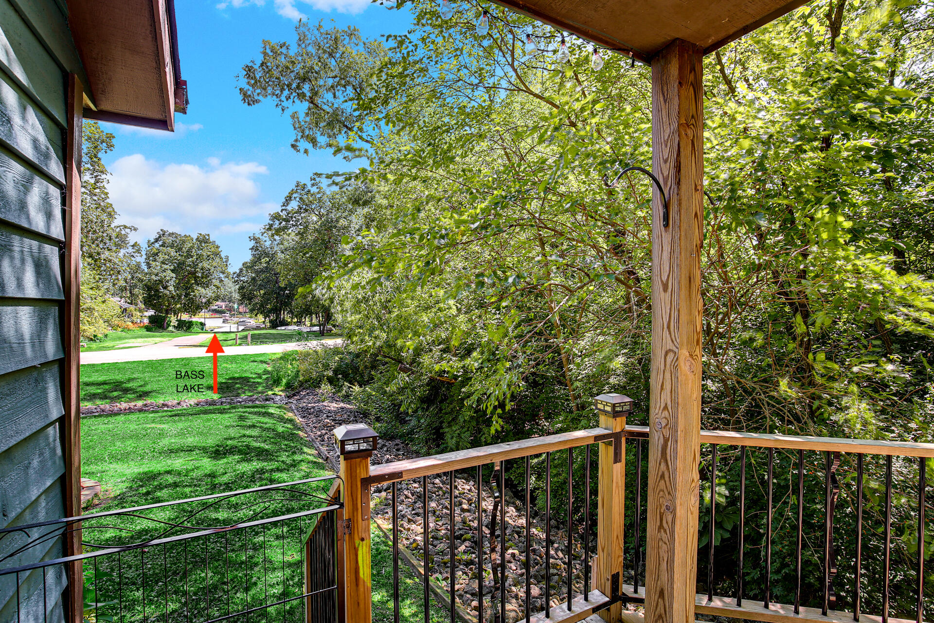 2196 Elm Tree Lane Crown Point, IN 46307 - Photo 12 of 30 a view of a wooden fence and trees in the background