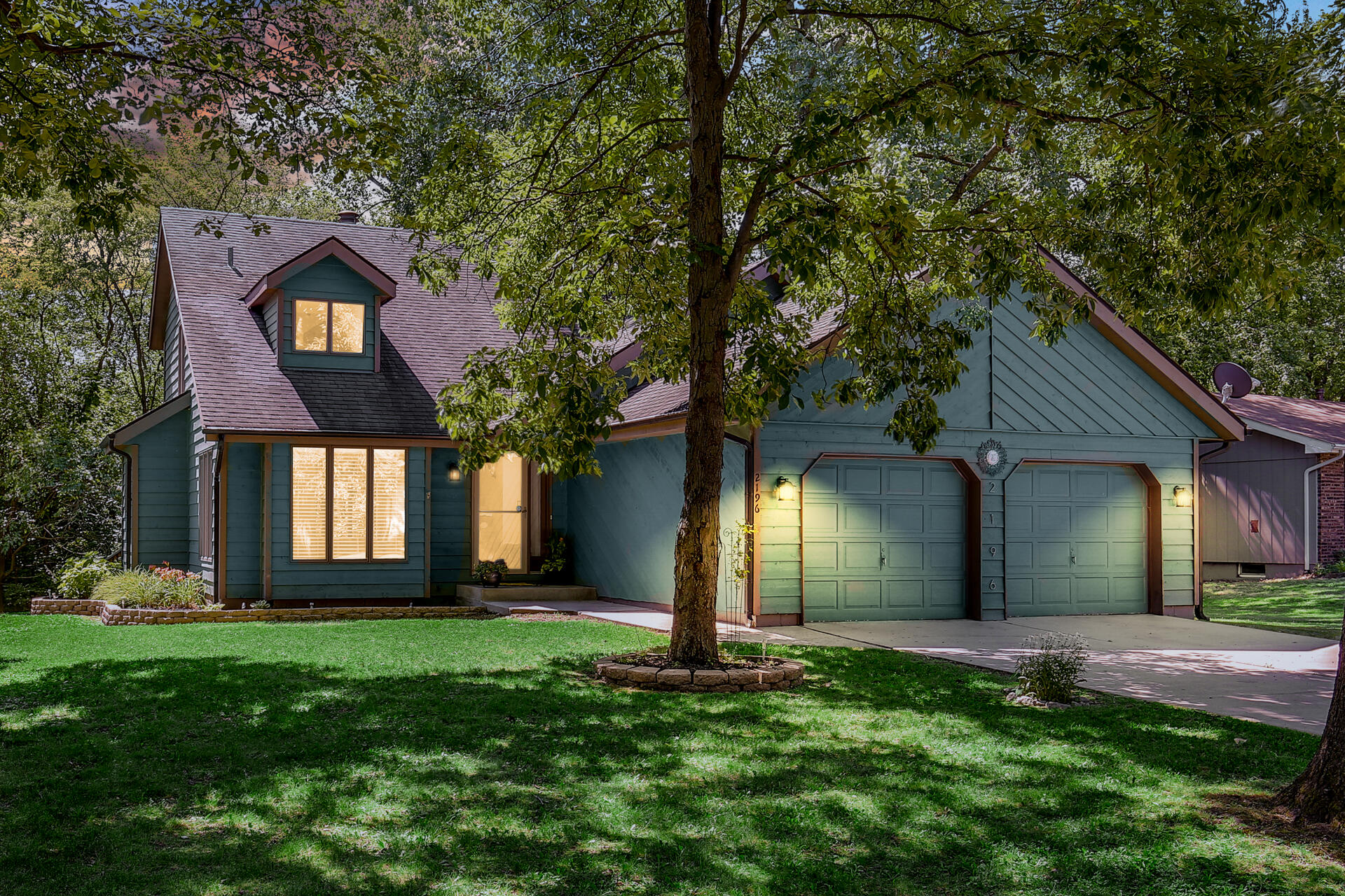2196 Elm Tree Lane Crown Point, IN 46307 - Photo 2 of 30 a front view of house with yard and green space