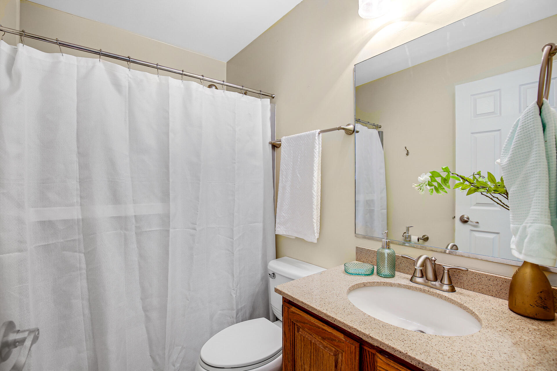2196 Elm Tree Lane Crown Point, IN 46307 - Photo 21 of 30 a bathroom with a granite countertop sink and a mirror