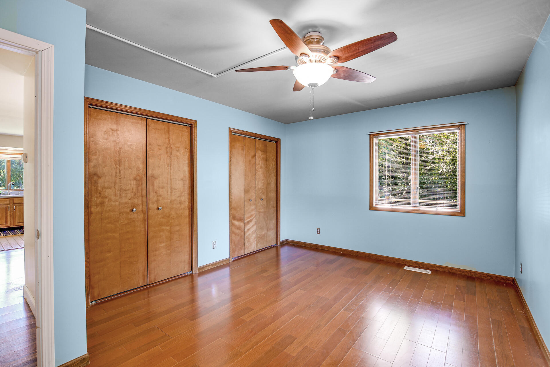 2196 Elm Tree Lane Crown Point, IN 46307 - Photo 22 of 30 an empty room with wooden floor and windows