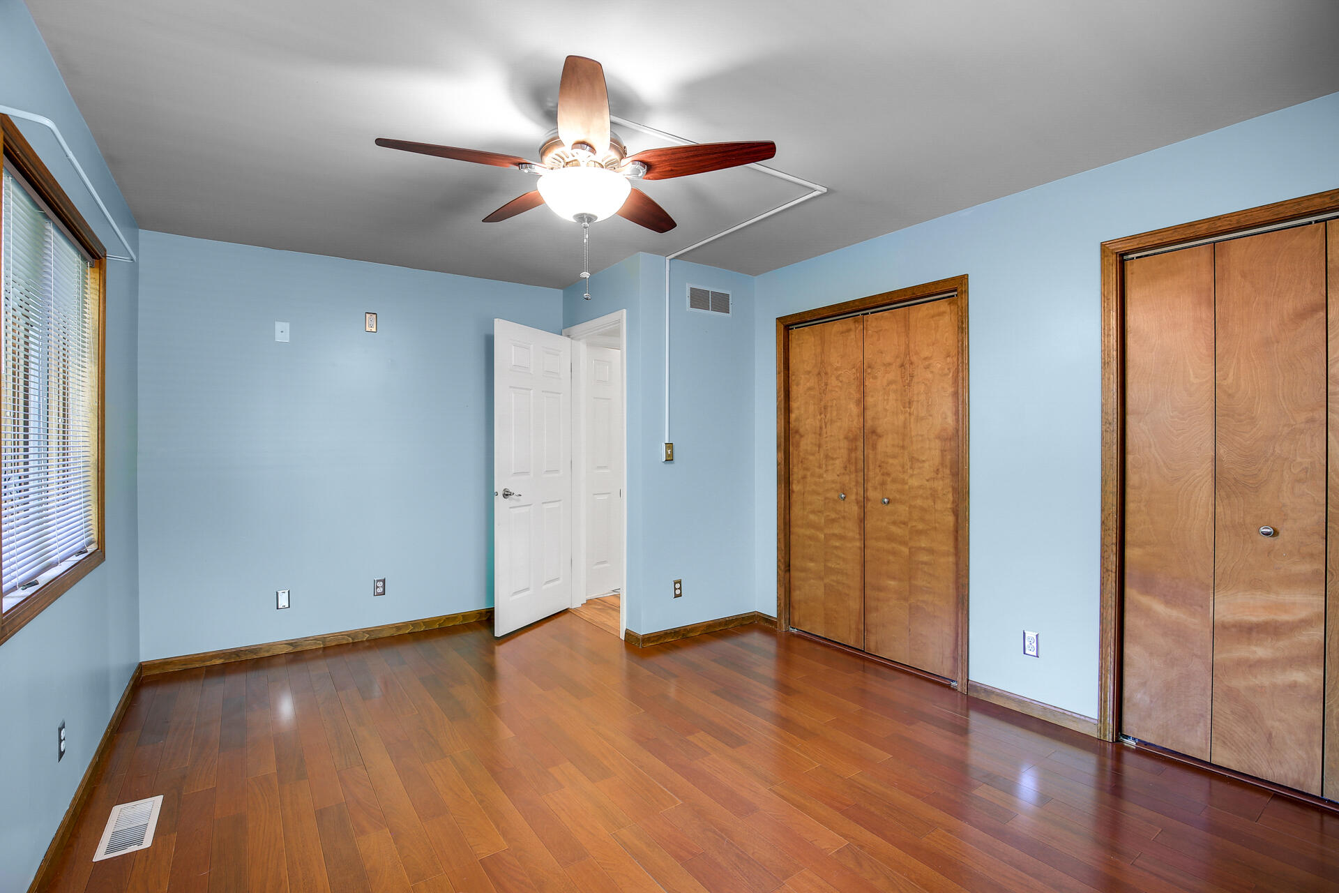 2196 Elm Tree Lane Crown Point, IN 46307 - Photo 23 of 30 a view of an empty room with wooden floor and a window