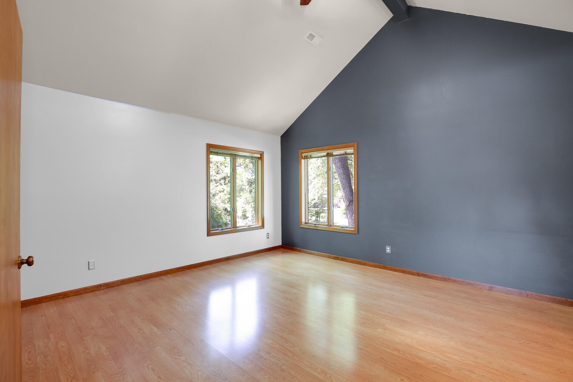 2196 Elm Tree Lane Crown Point, IN 46307 - Photo 26 of 30 an empty room with wooden floor and windows