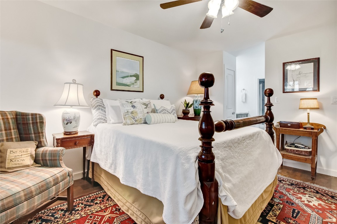 3426 Sea Marsh Road Fernandina Beach, FL 32034 - Photo 23 of 65 a bed room with a bed and a chandelier