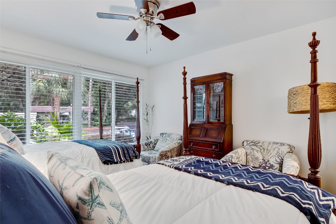 3426 Sea Marsh Road Fernandina Beach, FL 32034 - Photo 29 of 65 a bedroom with a bed couch and a window