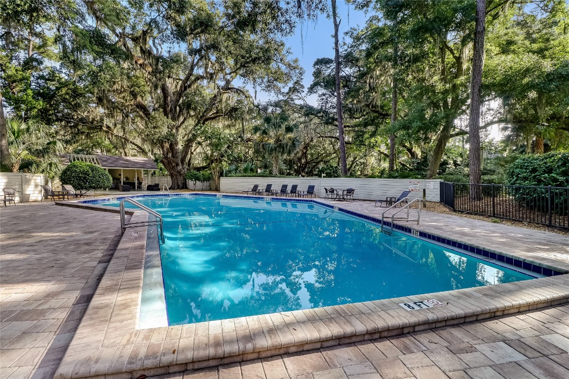 3426 Sea Marsh Road Fernandina Beach, FL 32034 - Photo 43 of 65 a view of a swimming pool with a patio