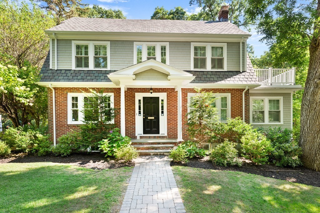 28 Hillside Road Wellesley, MA 02481 - Photo 3 of 25 a view of a house with a yard and plants