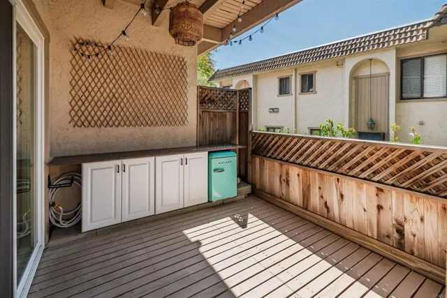 a view of a porch with wooden floor