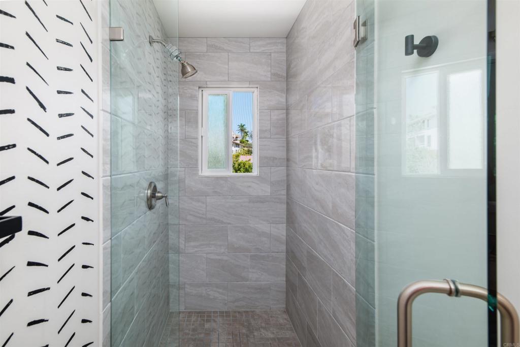 2349 Altisma Way, Unit B Carlsbad, CA 92009 - Photo 17 of 27 a bathroom with a shower