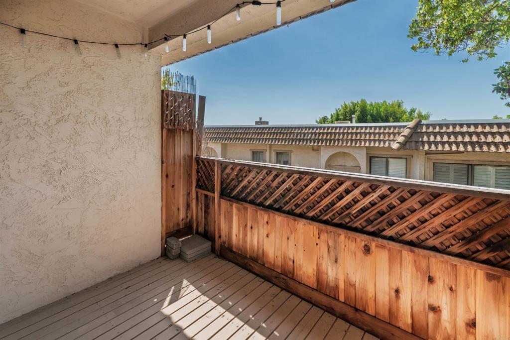 2349 Altisma Way, Unit B Carlsbad, CA 92009 - Photo 22 of 27 a view of balcony with wooden floor