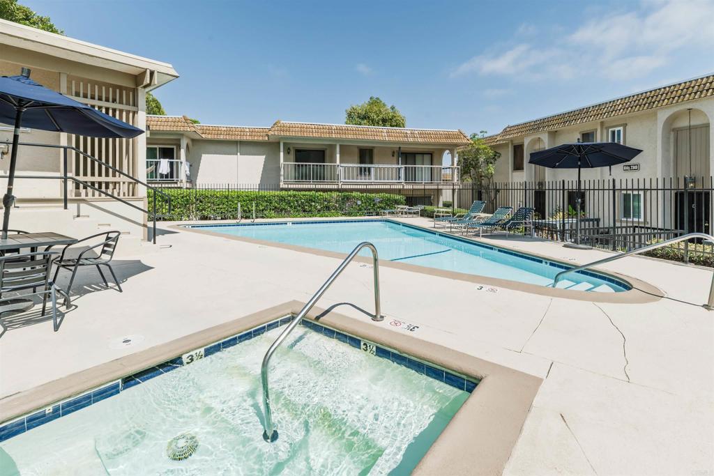 2349 Altisma Way, Unit B Carlsbad, CA 92009 - Photo 24 of 27 a view of a house with swimming pool and sitting area