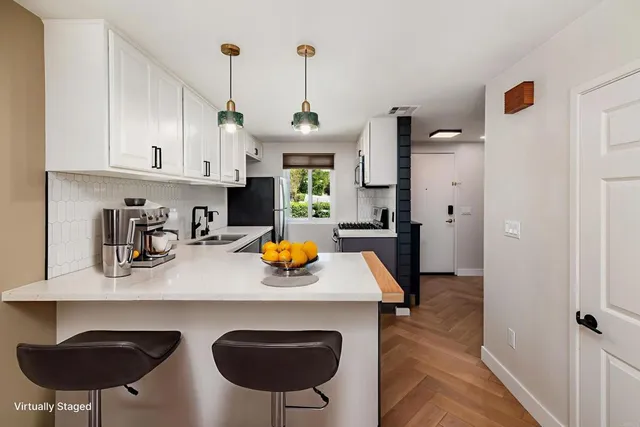 a view of kitchen and sink with wooden floor