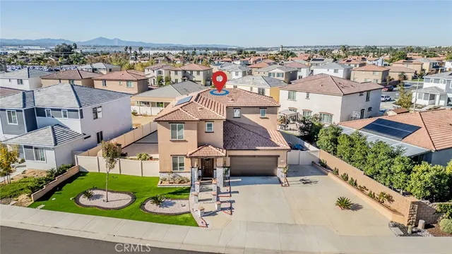 an aerial view of a house with garden