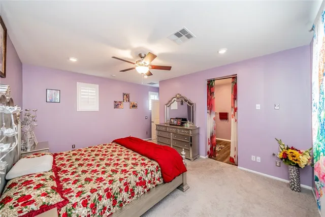 a bedroom with bed and window