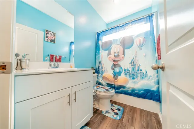 a bedroom with a bed and a mirror