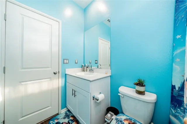 a bedroom with a bed and cabinets