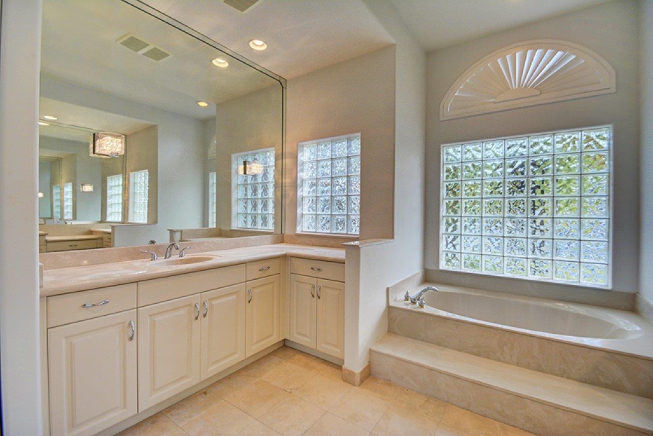 19473 Saturnia Lakes Drive Boca Raton, FL 33498 - Photo 12 of 22 a spacious bathroom with sink shower and bathtub