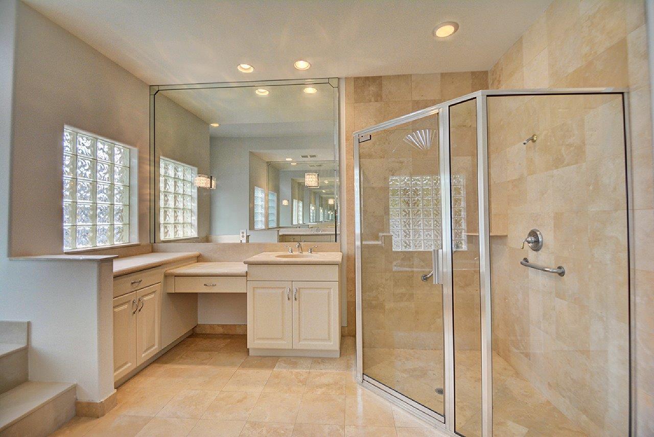19473 Saturnia Lakes Drive Boca Raton, FL 33498 - Photo 13 of 22 a bathroom with a bathtub and a shower