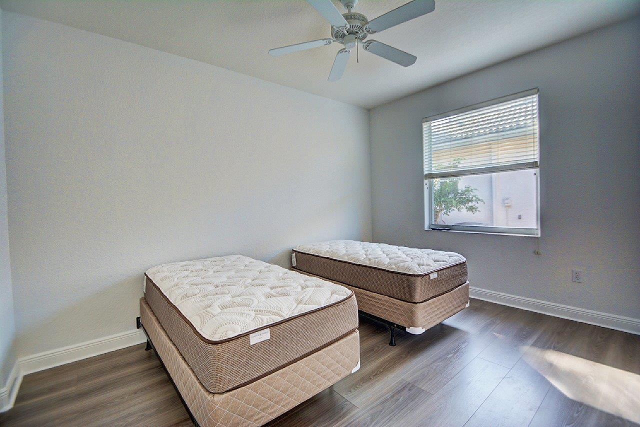 19473 Saturnia Lakes Drive Boca Raton, FL 33498 - Photo 14 of 22 a living room with furniture and a window