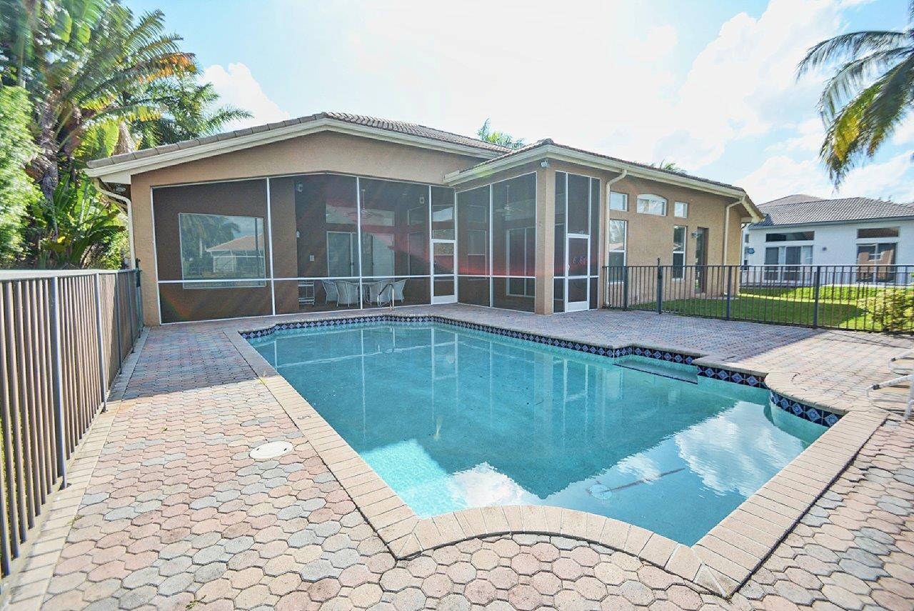 19473 Saturnia Lakes Drive Boca Raton, FL 33498 - Photo 20 of 22 a view of a house with a swimming pool