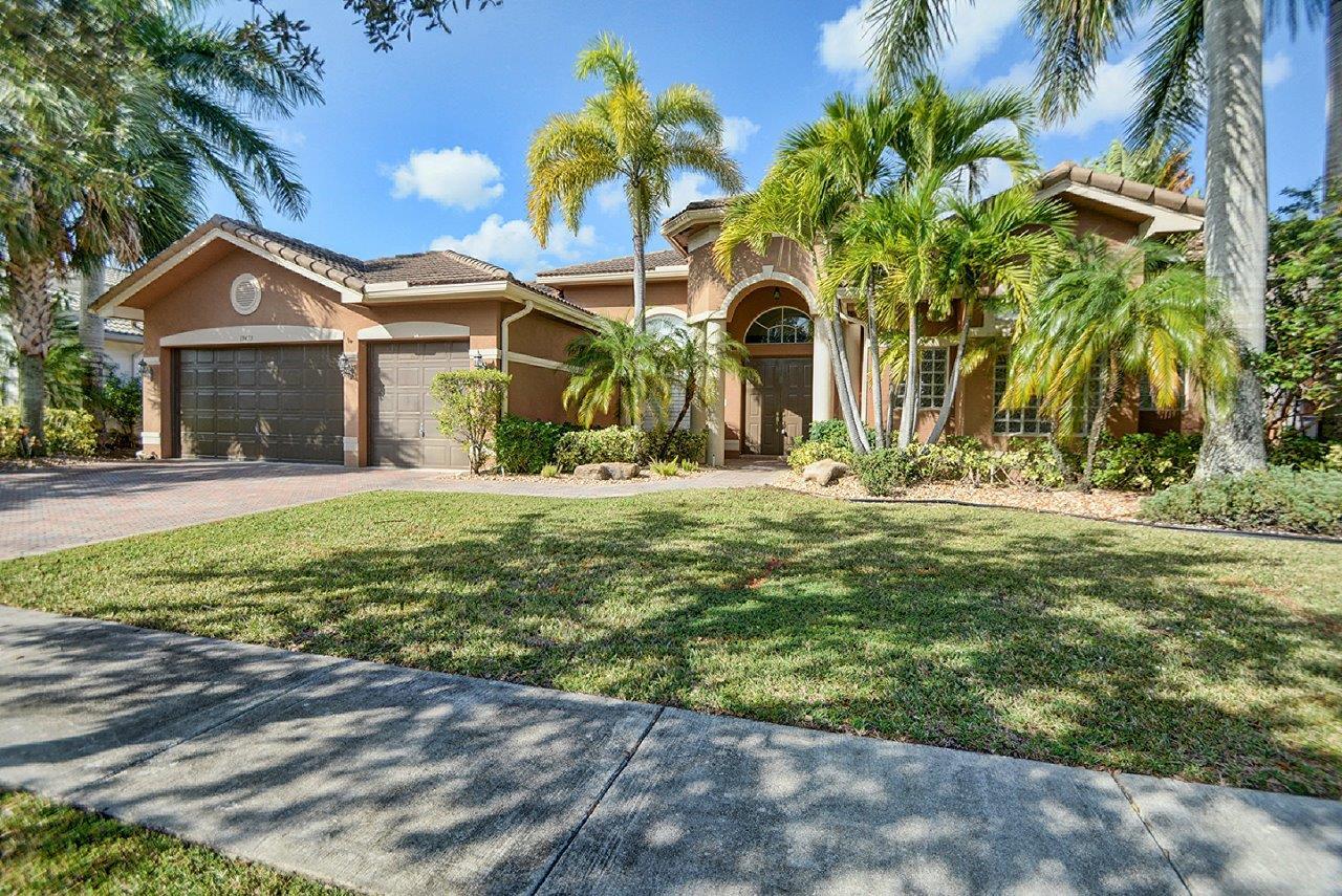 19473 Saturnia Lakes Drive Boca Raton, FL 33498 - Photo 2 of 22 a view of a house with a yard