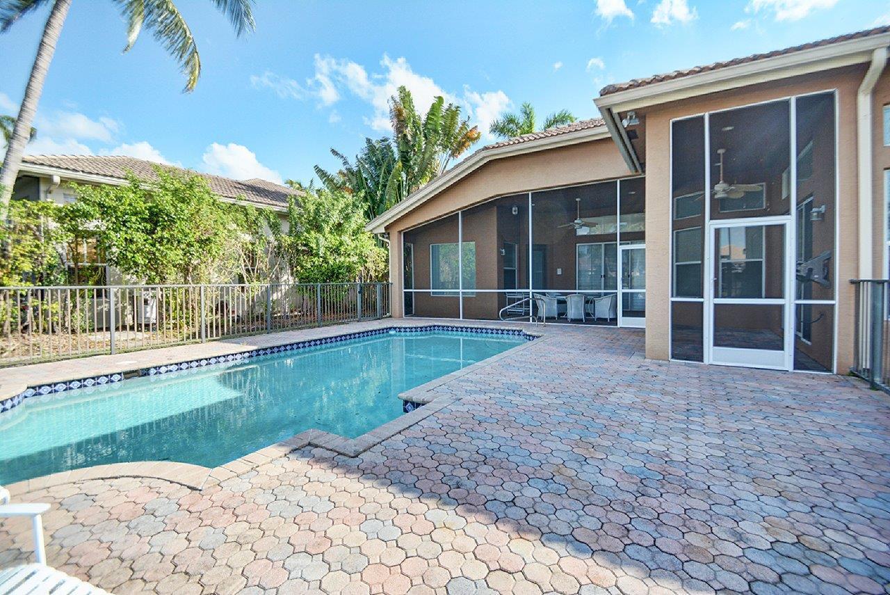 19473 Saturnia Lakes Drive Boca Raton, FL 33498 - Photo 21 of 22 a front view of a house with garden