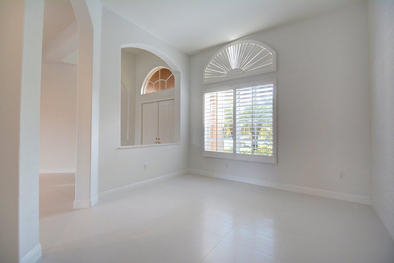 19473 Saturnia Lakes Drive Boca Raton, FL 33498 - Photo 5 of 22 an empty room that has a window