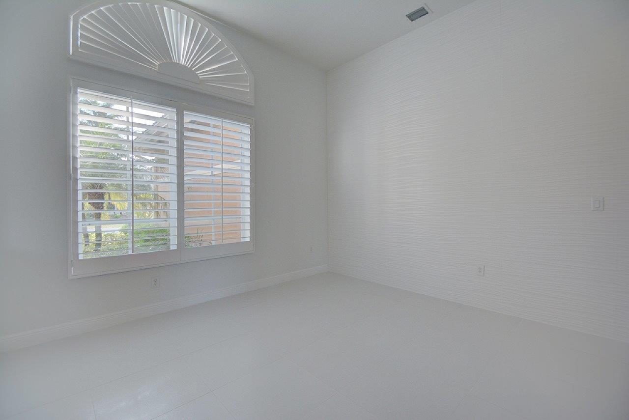 19473 Saturnia Lakes Drive Boca Raton, FL 33498 - Photo 6 of 22 an empty room with a windows and entrance
