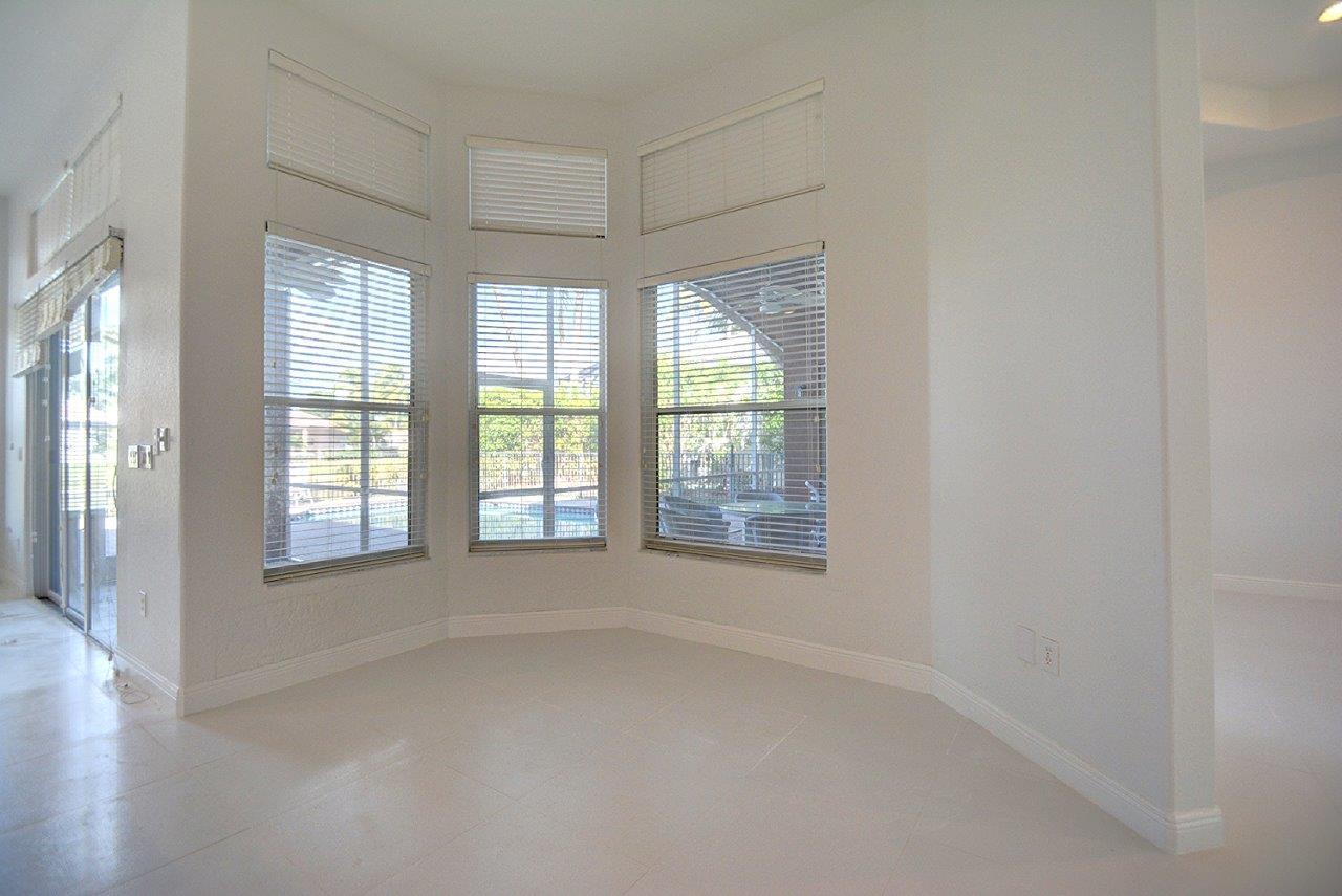 19473 Saturnia Lakes Drive Boca Raton, FL 33498 - Photo 8 of 22 a view of an empty room with a window