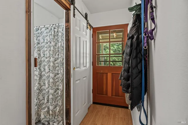 a bedroom with bed and a window