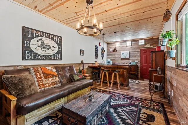 a living room with lots of furniture and a chandelier