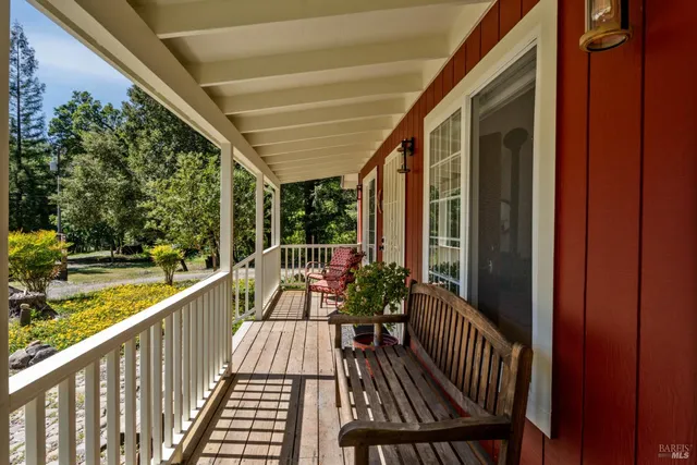 a view of balcony with wooden floor