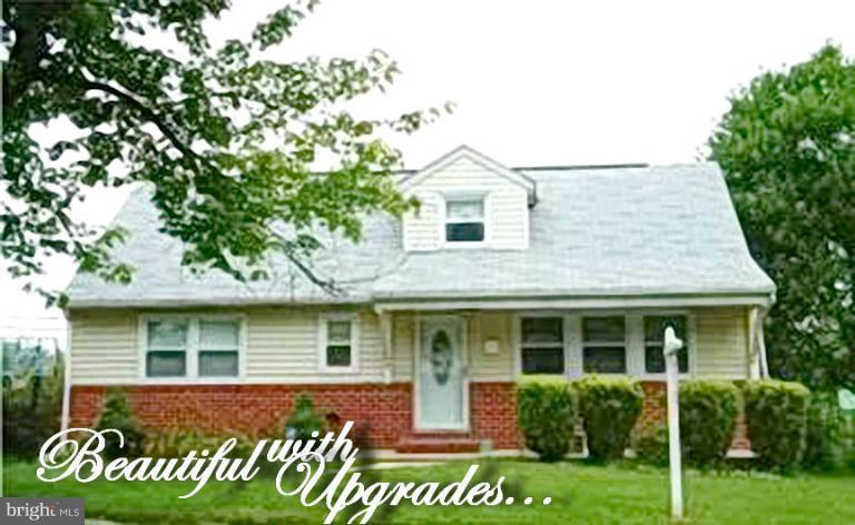 1934 Greengage Road Baltimore, MD 21244 - Photo 1 of 16 a front view of a house with garden