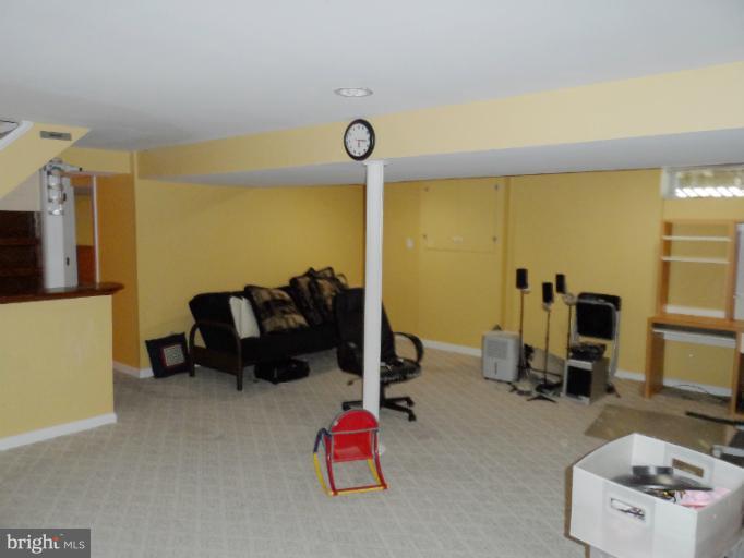 1934 Greengage Road Baltimore, MD 21244 - Photo 13 of 16 a bedroom with furniture and a flat screen tv